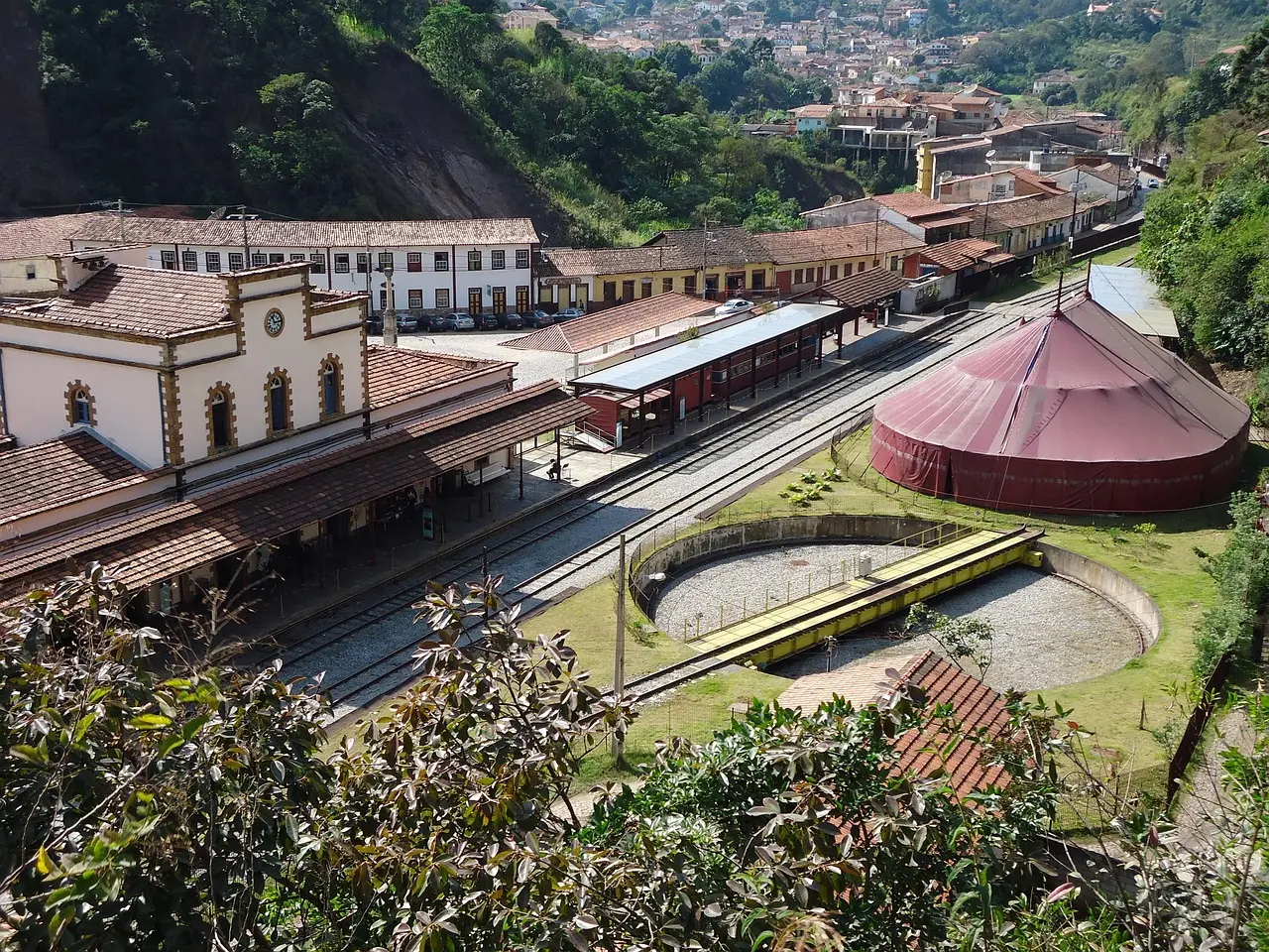 Ornate baroque facade of São Francisco de Assis Church in Ouro Preto, Minas Gerais — a masterpiece of colonial Brazilian architecture and Afro-Brazilian artistic legacy Baroque church facade with intricate stone carvings and colonial street in Ouro Preto