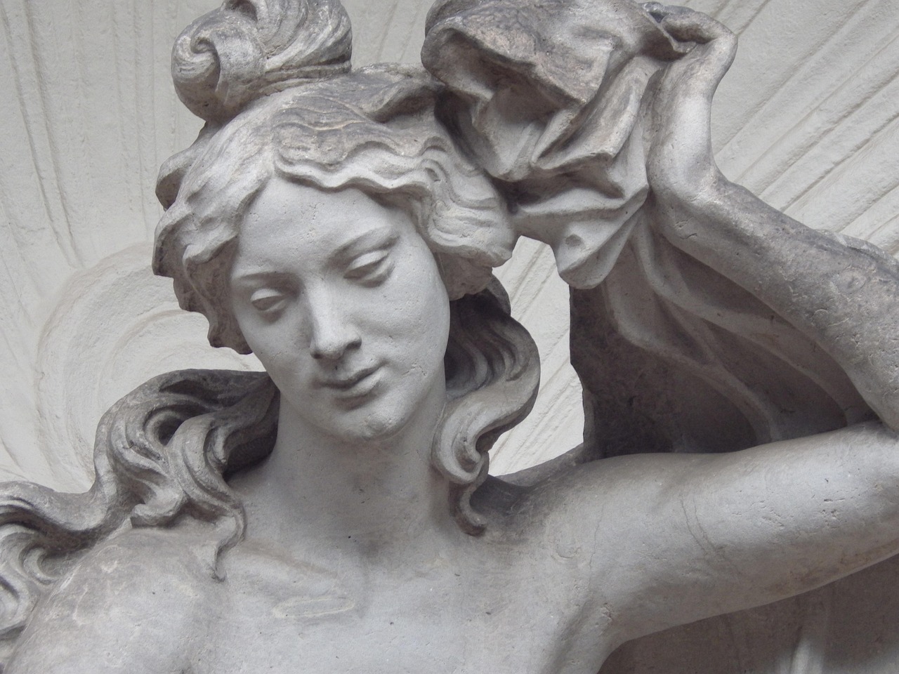 The opulent inner courtyard of Zwinger Palace in Dresden — adorned with mythological statues, cascading fountains, and sunlit stonework — a refined gem among the 15 must-visit places in Germany. Zwinger Palace courtyard in Dresden with ornate sculptures and fountains under blue sky