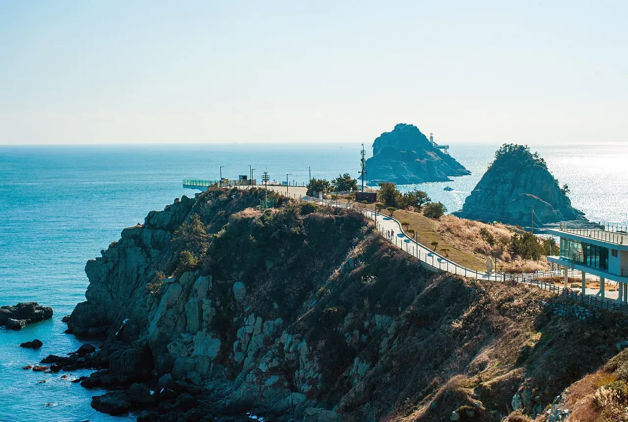 Dramatic glass skywalk overlooking the East Sea in Yangyang — a thrilling, scenic finale among Korea’s most memorable places in Korea Glass skywalk extending over cliff edge with ocean and mountains visible below