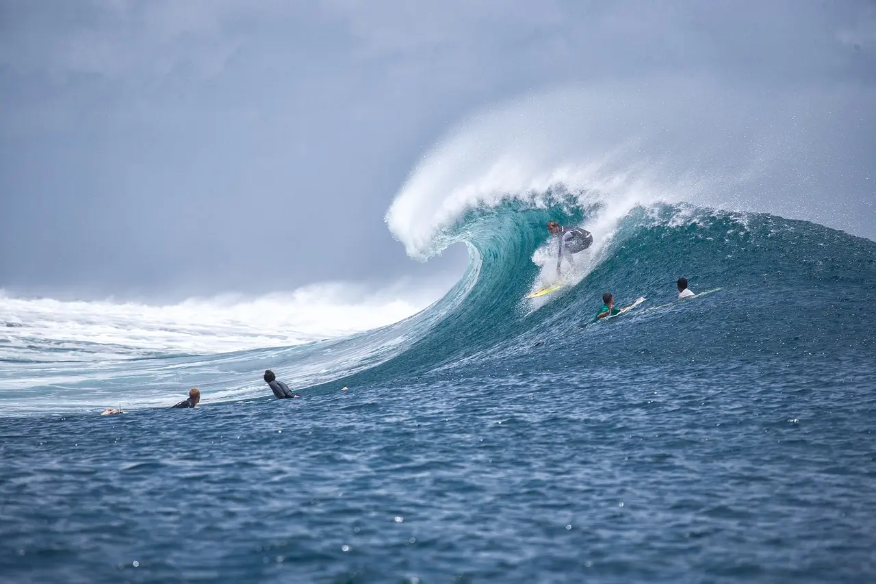 Massive Atlantic swell breaking at Praia do Norte in Nazaré, capturing a lone surfer inside the powerful green barrel Giant wave crashing at Praia do Norte in Nazaré with surfer visible in the barrel