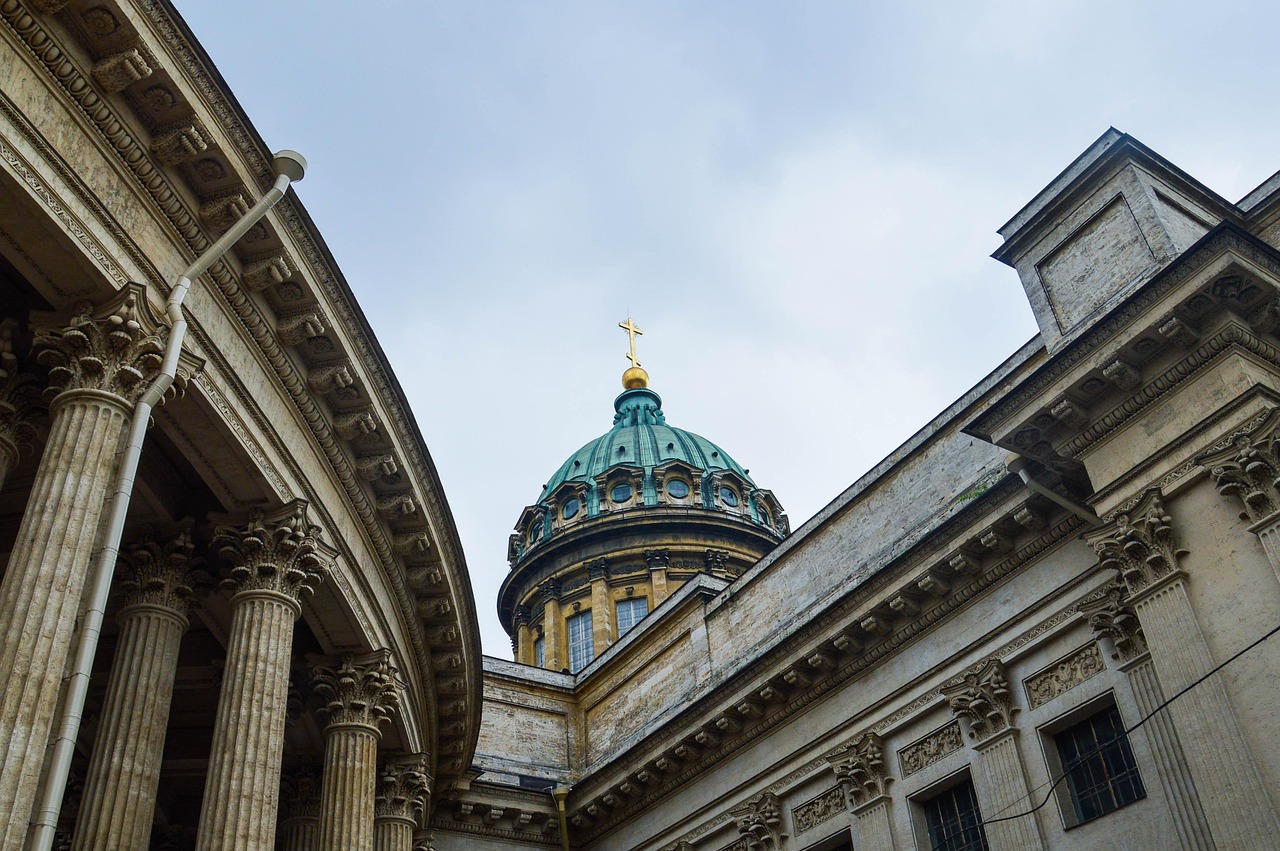Time-worn grandeur of St. David’s Cathedral set amid lush Welsh hills — a sacred pause among must-visit places in the UK Ancient stone cathedral surrounded by wildflowers and rolling green hills in Pembrokeshire