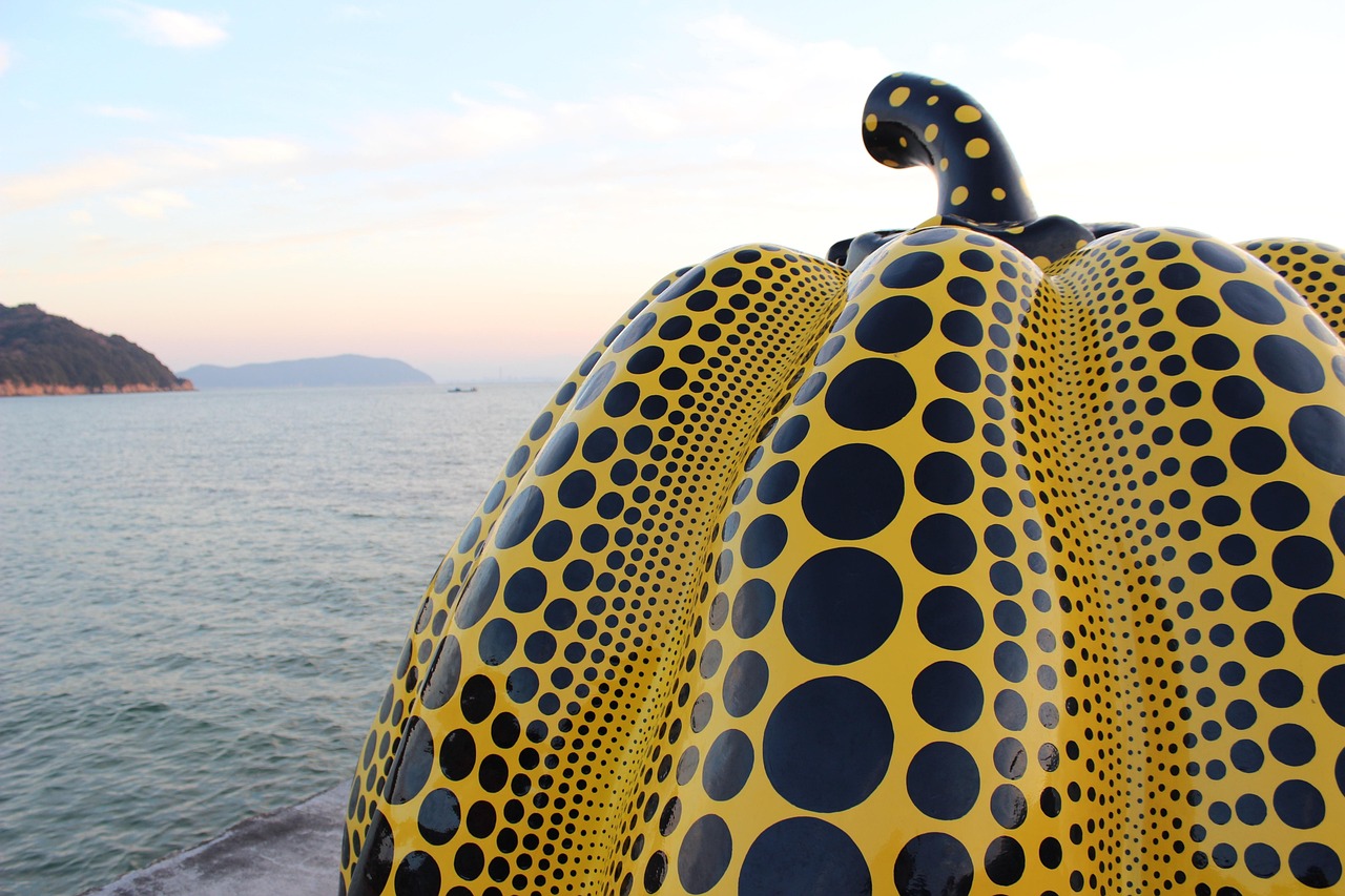 Yayoi Kusama’s iconic yellow pumpkin on Naoshima Island — a playful, world-famous landmark among the most creative places to visit in Japan Yellow polka-dot pumpkin sculpture by Yayoi Kusama on a seaside dock in Naoshima Island