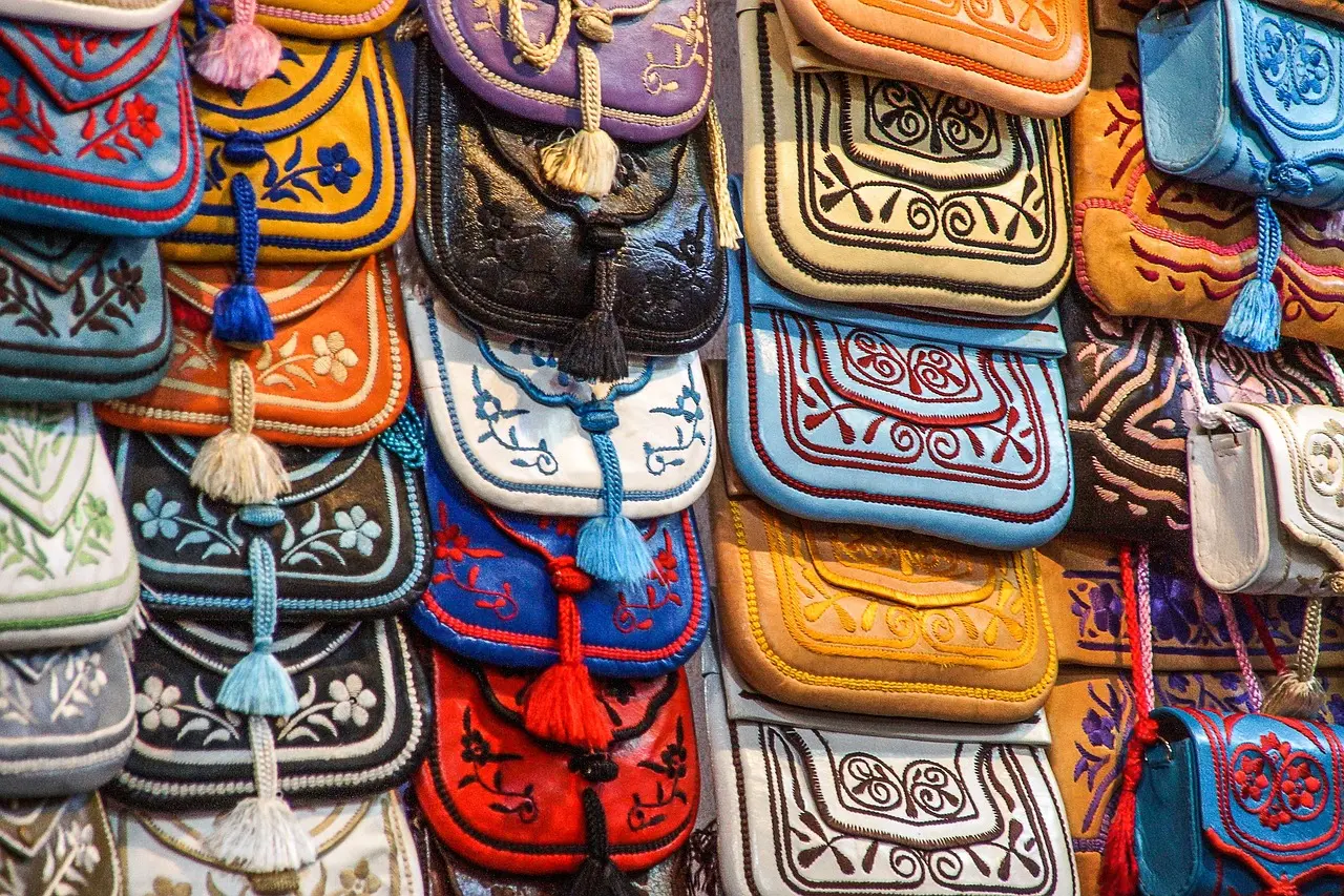 Colorful spice display at Marrakech’s Rahba Kedima square, showcasing hand-sorted saffron, cinnamon sticks, and ras el hanout blends Vibrant spice stall in Marrakech souk with mounds of turmeric, paprika, and cumin under warm light
