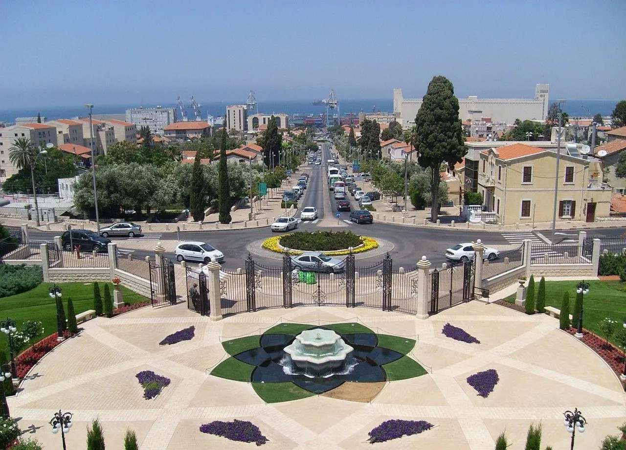 The luminous Baháʼí Gardens on Mount Carmel in Haifa — a masterpiece of spiritual architecture and a beacon of unity, welcoming all as part of the Baháʼí religious pilgrimage experience. Stunning terraced Baháʼí Gardens descending Mount Carmel in Haifa, lit at dusk with symmetrical pathways and fountains