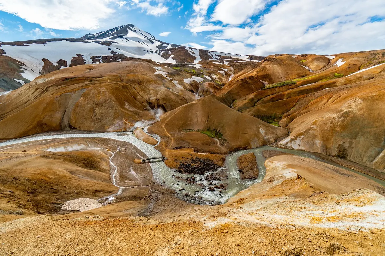 Relaxing in the Blue Lagoon — an ethereal, rejuvenating experience among European honeymoon destinations Blue Lagoon geothermal spa in Iceland with steam rising from milky-blue waters surrounded by black lava fields