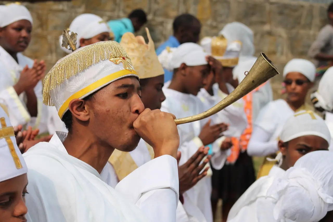 Tabot procession during Timkat in Addis Ababa — a radiant cultural experience through local festivals and folk performances in Ethiopia Ethiopian Orthodox priests carrying ornate Tabot replicas under embroidered canopies during Timkat festival
