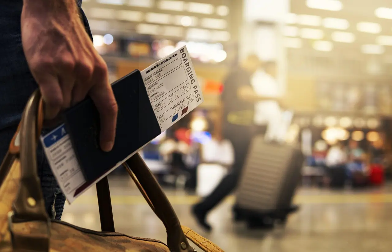 Busy yet organized Sydney Airport terminal illustrating efficient TRS integration for international shopping consumption Sydney Airport international terminal with duty-free shops, traveler checking boarding pass, and luggage carts
